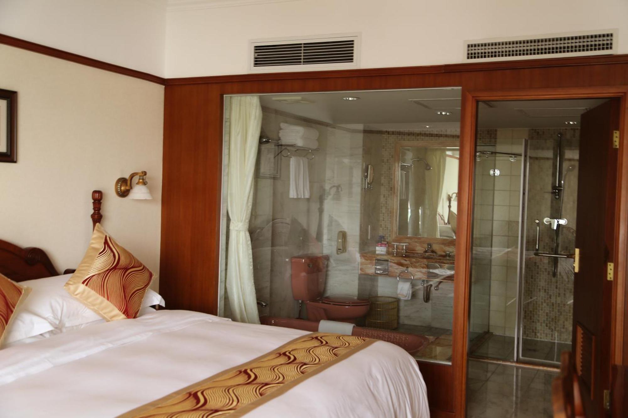Huiquan Dynasty Hotel Thanh Đảo Phòng bức ảnh